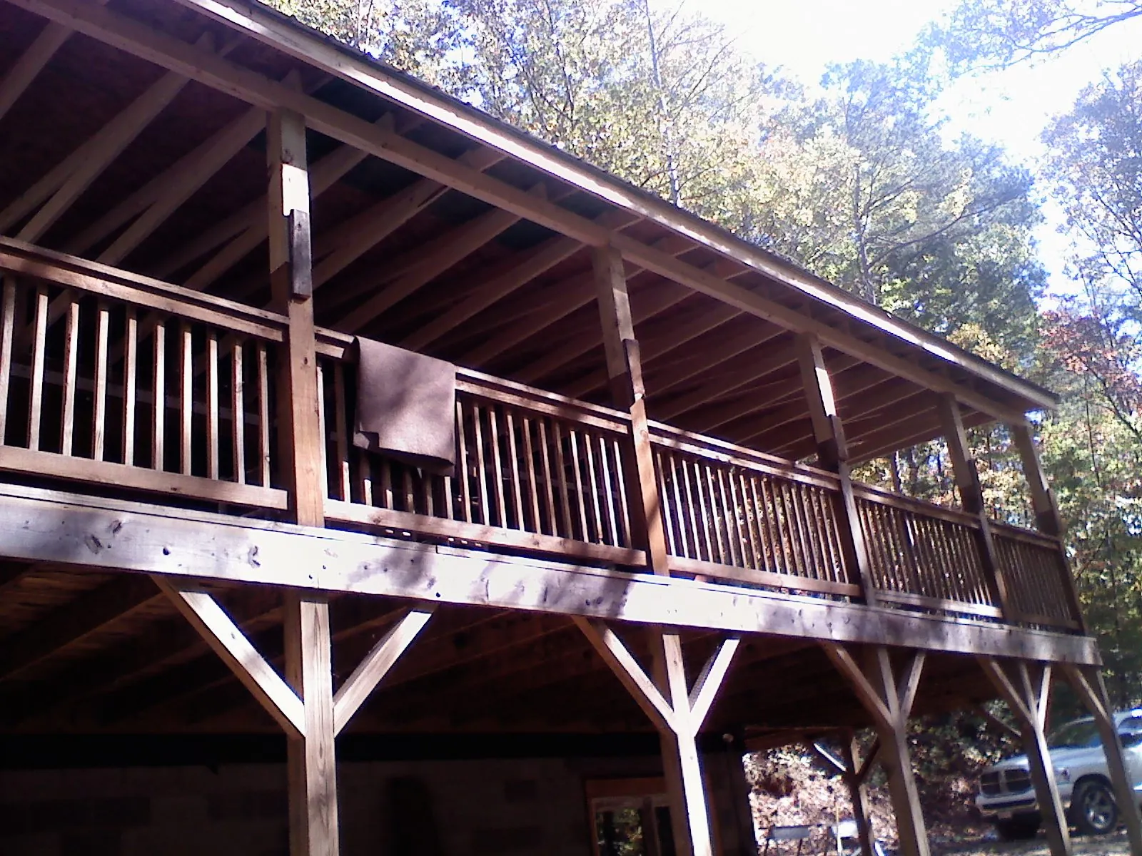 Timber framing under a new elevated porch and deck — Roof Leak Repair in Buda by Roofing Brothers